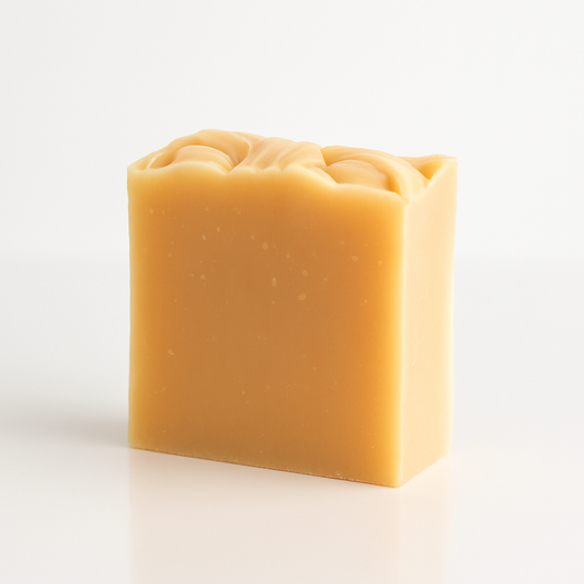 Square bar of soap with a textured surface on a white background