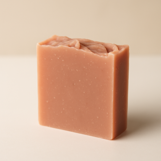 Bar of rose soap on a beige background