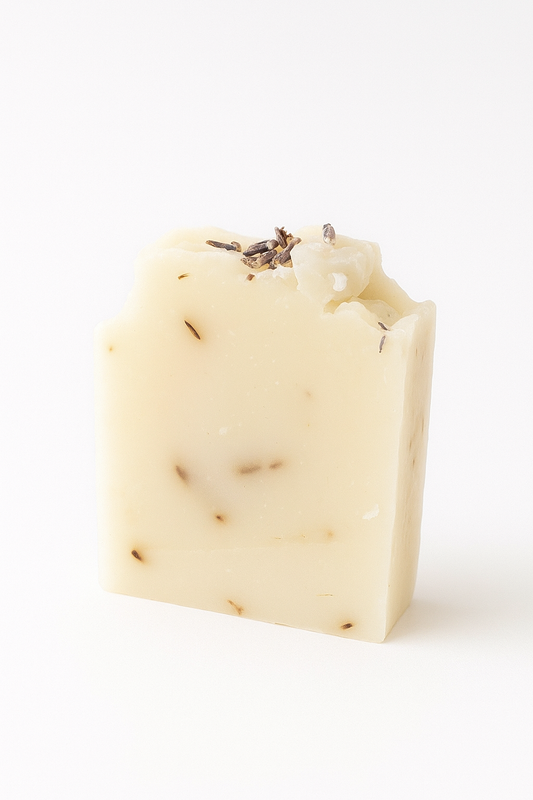 Bar of soap with lavender buds on a white background